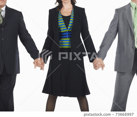 Businesspeople Holding Hands Businesspeople Holding Hands 73668997