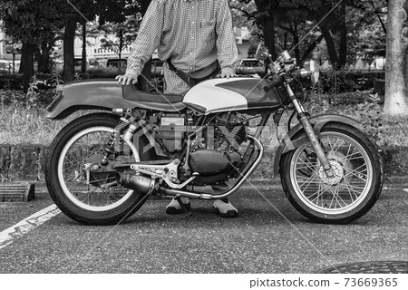 Bike life senior rider and classic bike black and white film style processing Bike life senior rider and classic bike black and white film style processing 73669365