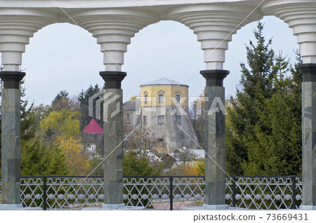 Ksido castle through collonade, Khmilnyk Ksido castle through collonade, Khmilnyk 73669431