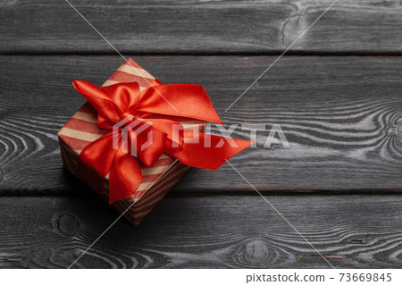 St. Valentine's day gift for a woman on wooden background 73669845