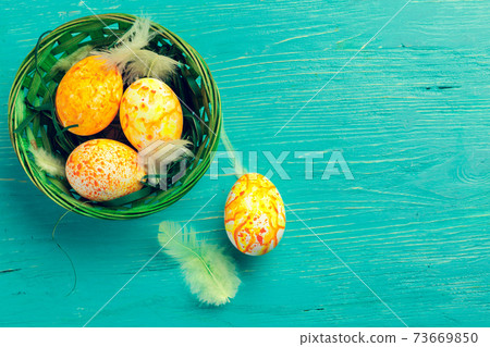Yellow Easter Eggs On Wooden Background. Close up. Yellow Easter Eggs On Wooden Background. Close up. 73669850