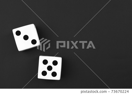 casino dices on the black background. Close up. casino dices on the black background. Close up. 73670224