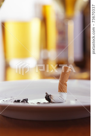 Cigarettes in an Ashtray 73670337