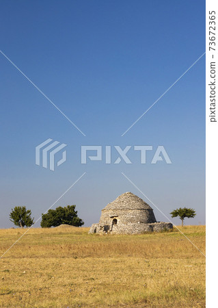 Trulli, typical houses near Castel del Monte, Apulia region, Italy Trulli, typical houses near Castel del Monte, Apulia region, Italy 73672365