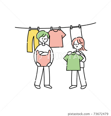 A couple hanging up the laundry 73672479