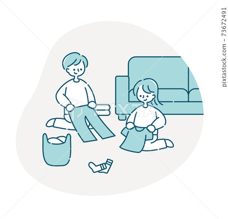 A couple folding the laundry A couple folding the laundry 73672491