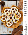 Festive pretzels on the plate with autumn background setup in a selective focus 73672835