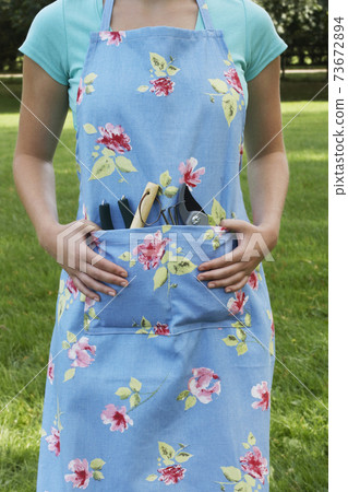 Woman With Gardening Tools 73672894