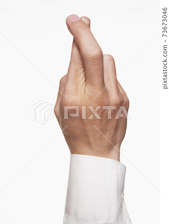 Closeup Of Fingers Crossed 73673046