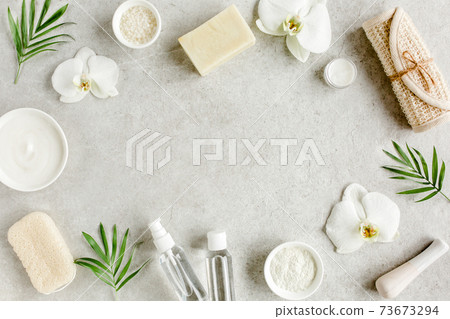 Spa treatment concept. Natural,Organic spa cosmetics products, sea salt, massage brush. Spa background with a space for a text, flat lay, top  73673294