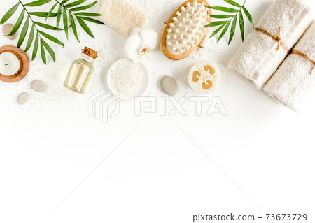 Spa Background. Natural Organic spa cosmetics products, eco friendly bathroom accessories, palm leaves. Skincare concept on white background. Flat lay Spa Background. Natural Organic spa cosmetics products, eco friendly bathroom accessories, palm leaves. Skincare concept on white background. Flat lay 73673729