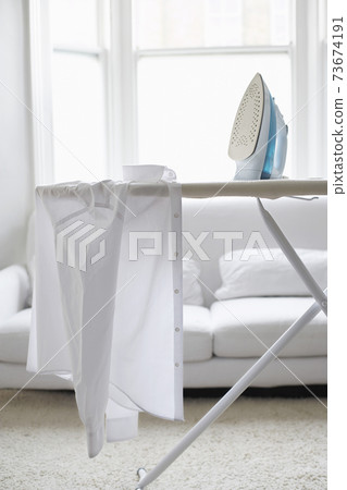 Shirt And Iron On Ironing Board Shirt And Iron On Ironing Board 73674191
