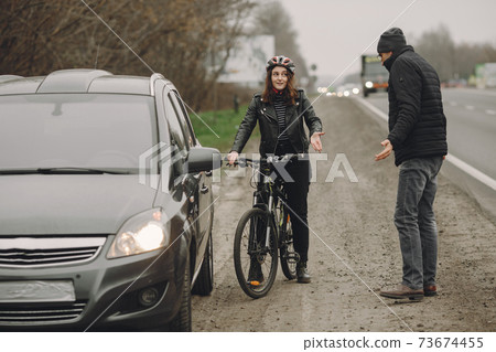 Road accident with cyclist man driver and car 73674455