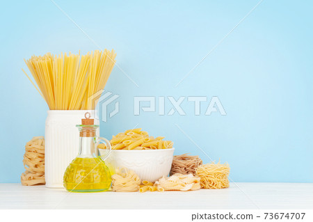 Various types of Italian pasta and olive oil 73674707