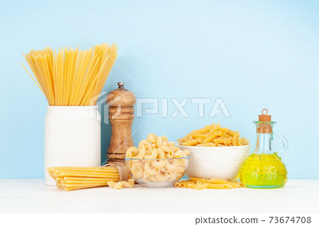 Various types of Italian pasta and olive oil 73674708