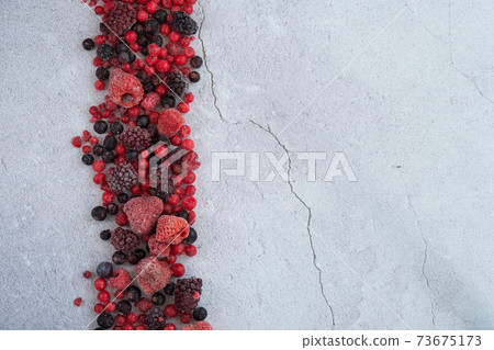 red berries scattered on a white background red berries scattered on a white background 73675173