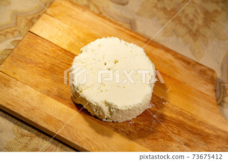 Homemade cheese made from natural milk 73675412