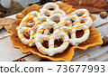 Glazed pretzels on the plate with autumn setup, season holiday concept 73677993