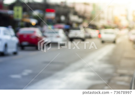 blurred focus of city road on cloudy day blurred focus of city road on cloudy day 73678997