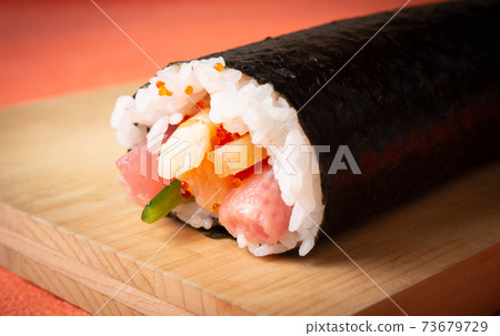 Thick sushi rolls on a cutting board, Ehomaki sushi rolls, thick sushi rolls 73679729