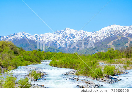Scenery of Hakuba Village (Spring): Overlooking the Northern Alps with residual snow Scenery of Hakuba Village (Spring): Overlooking the Northern Alps with residual snow 73680906