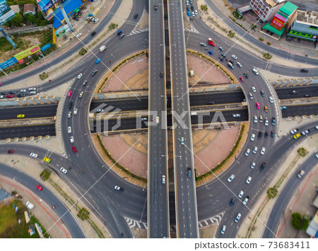 Roundabout city traffic road with vehicle movement hurry up Roundabout city traffic road with vehicle movement hurry up 73683411