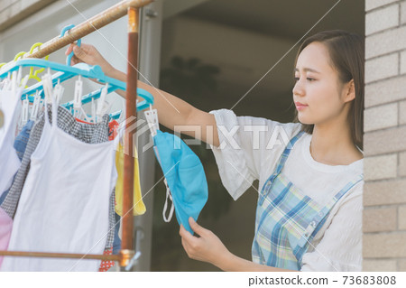 Laundry and housewife Laundry and housewife 73683808