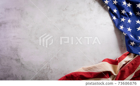 Happy presidents day concept with flag of the United States on old stone background. 73686876