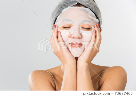 A woman doing a face pack A woman doing a face pack 73687463