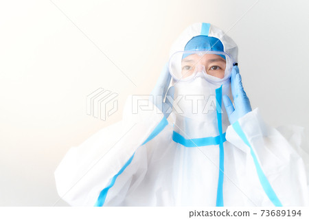 Woman wearing protective clothing 73689194