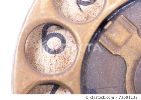 Old bronze antique rotary style telephone Old bronze antique rotary style telephone 73691132