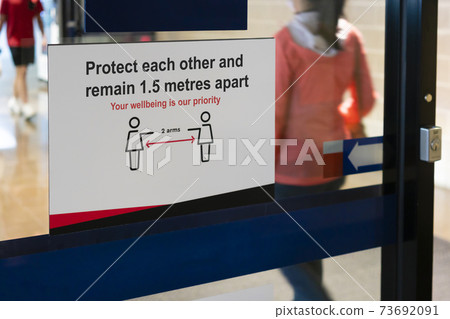 Social distancing sign outisde a shopping mall Social distancing sign outisde a shopping mall 73692091