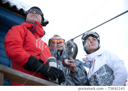 Group Of Friends Enjoying Hot Mulled Wine In Cafe At Ski Resort Group Of Friends Enjoying Hot Mulled Wine In Cafe At Ski Resort 73692141