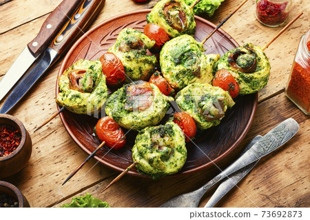 Chicken skewers on rustic wooden table 73692873