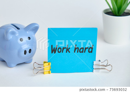 Hand lettering on the sticker work hard on a white background. Hand lettering on the sticker work hard on a white background. 73693032