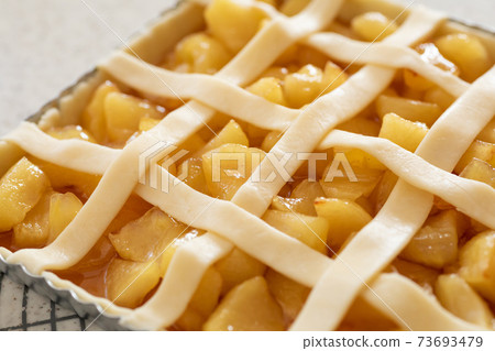 Making sweets at home Apple pie before baking in the oven 73693479