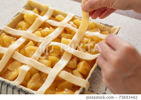Making sweets at home Apple pie before baking in the oven 73693482