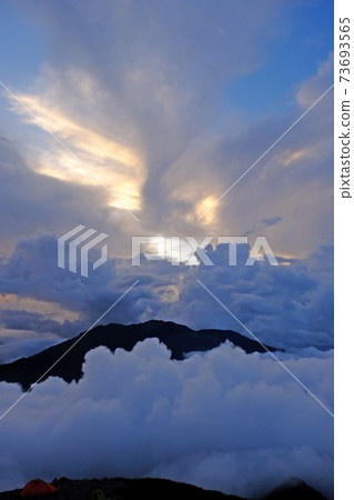 Cumulus clouds in the evening from around the hut near the summit of Mt. Kitadake in the Southern Alps 73693565