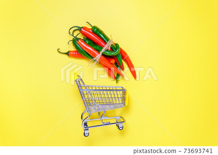 Chili peppers on yellow background, top view. day Chile, copyspace. purchase, hot offer, sale Chili peppers on yellow background, top view. day Chile, copyspace. purchase, hot offer, sale 73693741