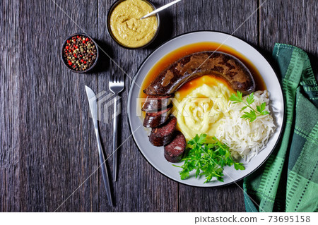 German food: blutwurst with potato and sauerkraut German food: blutwurst with potato and sauerkraut 73695158