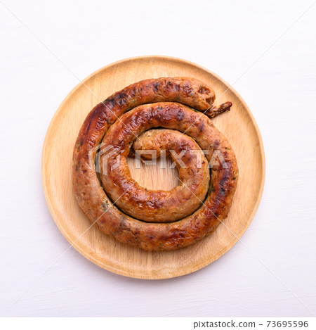 Northern Thai sausage (Sai Aua), Grilled intestine stuffed with minced pork, spices and herbs Northern Thai sausage (Sai Aua), Grilled intestine stuffed with minced pork, spices and herbs 73695596