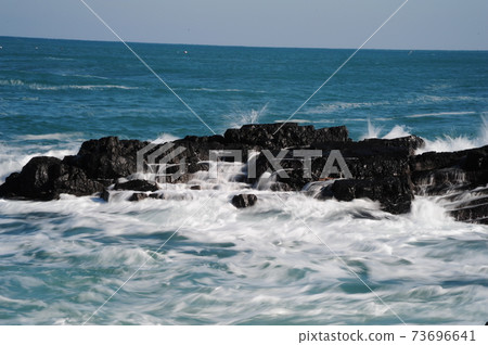 Wave, white wave, rock island, wind. Wave, white wave, rock island, wind. 73696641