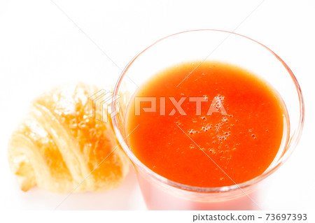 Tomato juice in a glass. Tomato juice in a glass. 73697393
