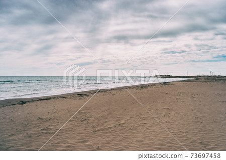 Lonely beach in the delta del ebro, tarragona, spain. Lonely beach in the delta del ebro, tarragona, spain. 73697458