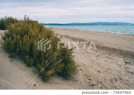Lonely beach in the delta del ebro, tarragona, spain. 73697460