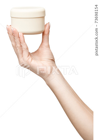 hand holding plastic can of cream Isolated on a white background 73698154