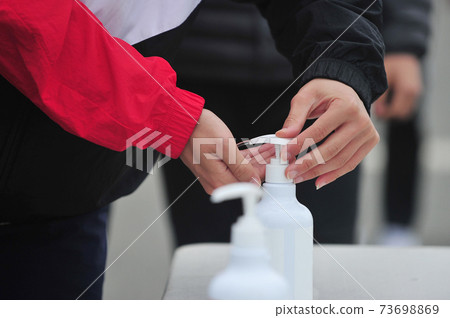 Corona hand disinfection 73698869