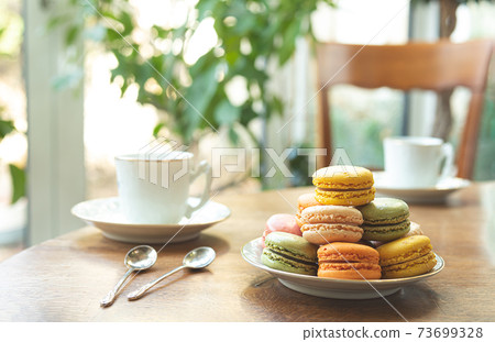 French breakfast with colorful macarons French breakfast with colorful macarons 73699328