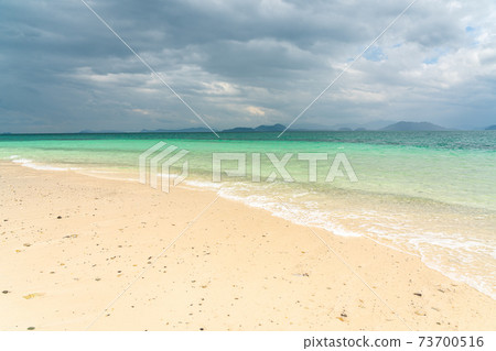 White sand beach in khang khao island, Ranong, Thailand in cloudy day. White sand beach in khang khao island, Ranong, Thailand in cloudy day. 73700516