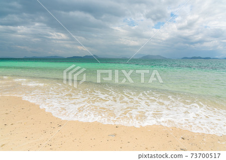 White sand beach in khang khao island, Ranong, Thailand in cloudy day. 73700517